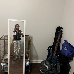 Black and White Striped Vest with White Pants